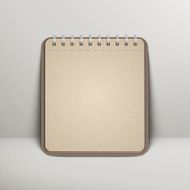open blank brown notebook over grey