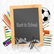 School supplies with blackboard on crumpled paper background