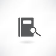 Open book and magnifying glass