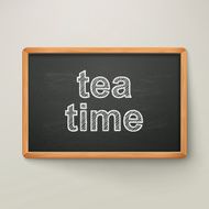 tea time on blackboard in wooden frame