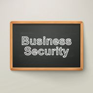 business security on blackboard in wooden frame