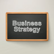 business strategy on blackboard in wooden frame