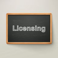 licensing on blackboard in wooden frame