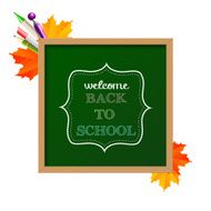 Chalkboard sign &quot;back to school&quot; with maple leaves and ballpoint