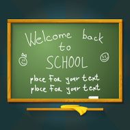 School desk with chalk welcome back message and place for N2
