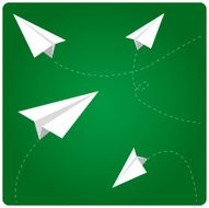 Paper airplanes flying in classroom