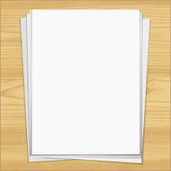 White notebook paper sheets isolated on wood background