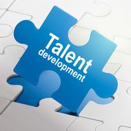 talent development on blue puzzle pieces