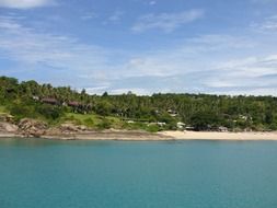 Landscape of the beautiful sea Island with green trees and sandy beach in Thailand