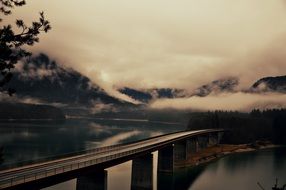 Distant view of the Sylvensteinscher dam in a valley in Upper Bavaria