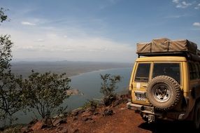 car stands on the edge of a cliff in Kenya