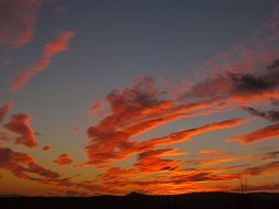 dramatic red clouds at evening sky, georgia, tbilisi