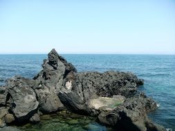 basalt stones in the sea