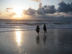 landscape of Children in the North Sea under the sunset