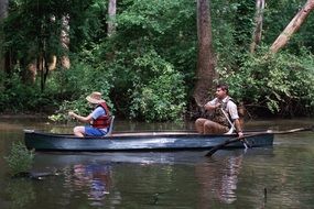 people on the boat float on the river