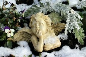 sculpture of a angel in the winter garden