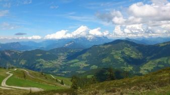 green mountains under a cloudy sky