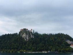 castle in the mountains in slovenia on a cloudy day