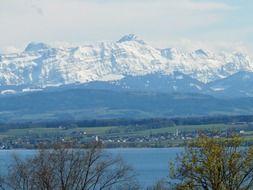 panoramic view of the snow-capped mountain peaks over Lake Constance