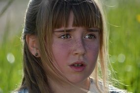 child face view on a blurred background