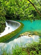 turquoise water and artifical watrfall, china, xiao qi kong