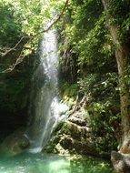 Beautiful waterfall among nature with beautiful and colorful plants on the island of Kythira in Greece