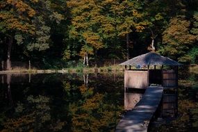 wooden gazebo on the pond