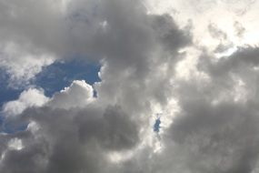 white clouds on the blue summer sky