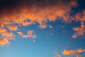 pink clouds in the blue sky