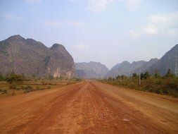 dirt road near the mountains in laos