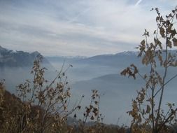 panorama of mountains in the autumn fog