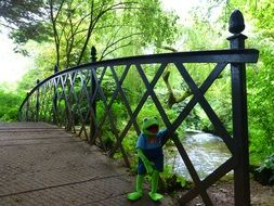 Green Kermit Frog on the bridge