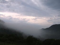 clouds in the mountains at dusk