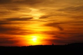 flame-colored sky at sunset
