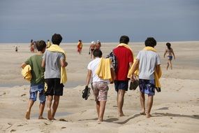 people go to the beach to swim in the sea