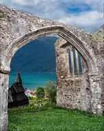 arch of stone ruins in a picturesque landscape