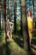 two girls in a sunny forest