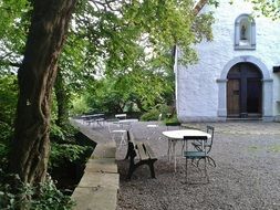 Tables and chairs near Wayside Chapel, germany