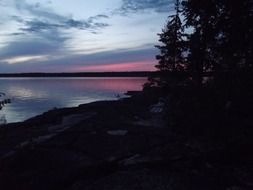 pink sunset in the clouds over the lake