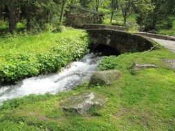 stone bridge at park landscape, poland