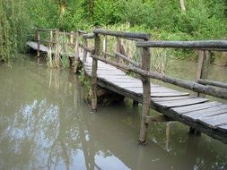 old wooden bridge across the pond