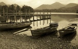 boats lake mountains view sepia