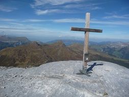 wooden cross on a stone