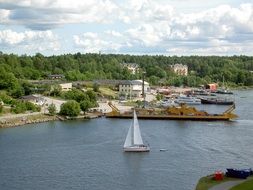sailboat near the shoreline on the water