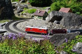 miniature railway with a red train