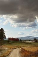 winding country road against a dark sky