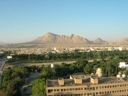 panoramic view of the city at the foot of the mountains in iran