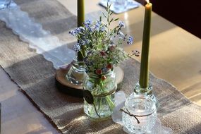 vase with wild flowers on the dining table