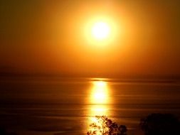 landscape of perfect sol bronze sunset over water