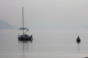sailing ship and coast buoy